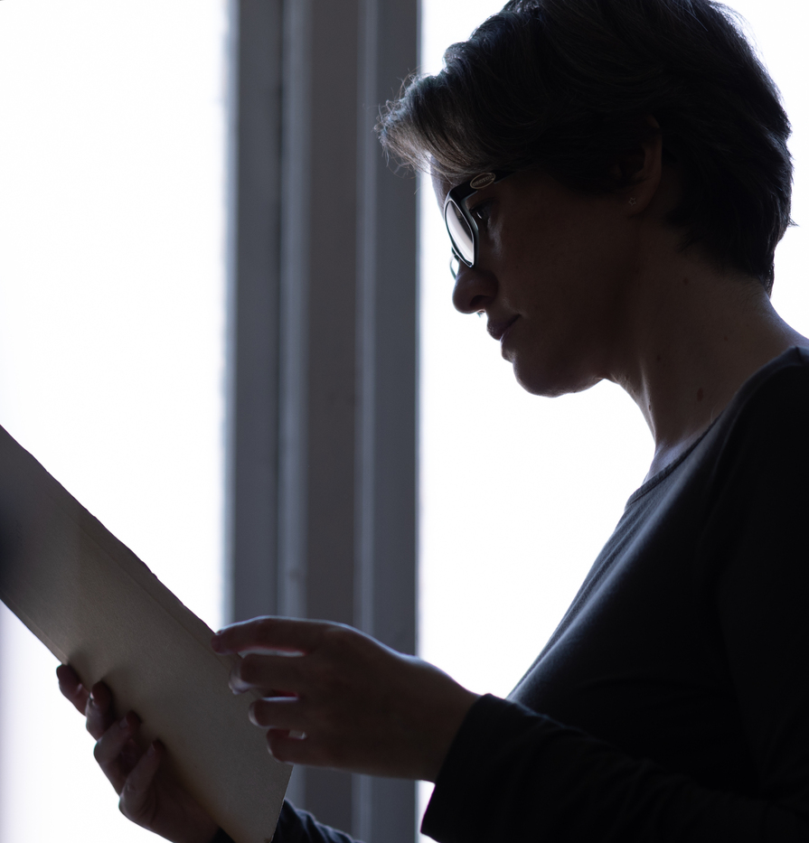 Suzy Howlett inspecting a document